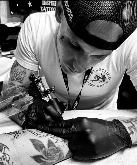 Image of Tyler Hall, artist at tattoo shop Cosmic Sea Tattoo in Portland, Maine